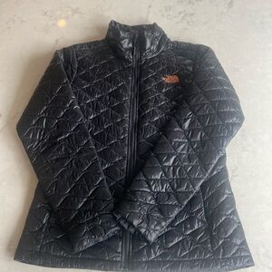 The North Face size M black quilted jacket